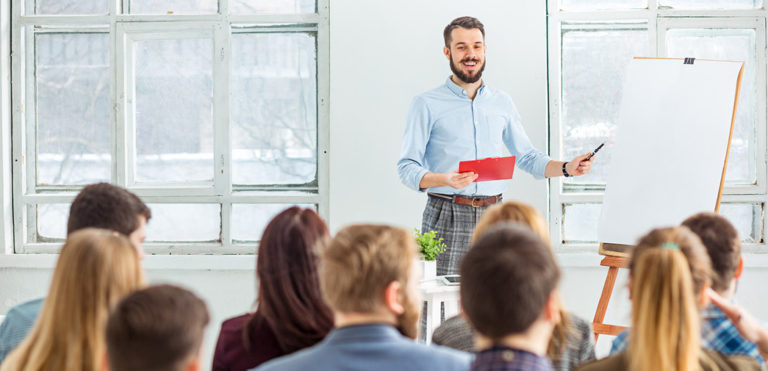 An agent speaks on a topic in a seminar