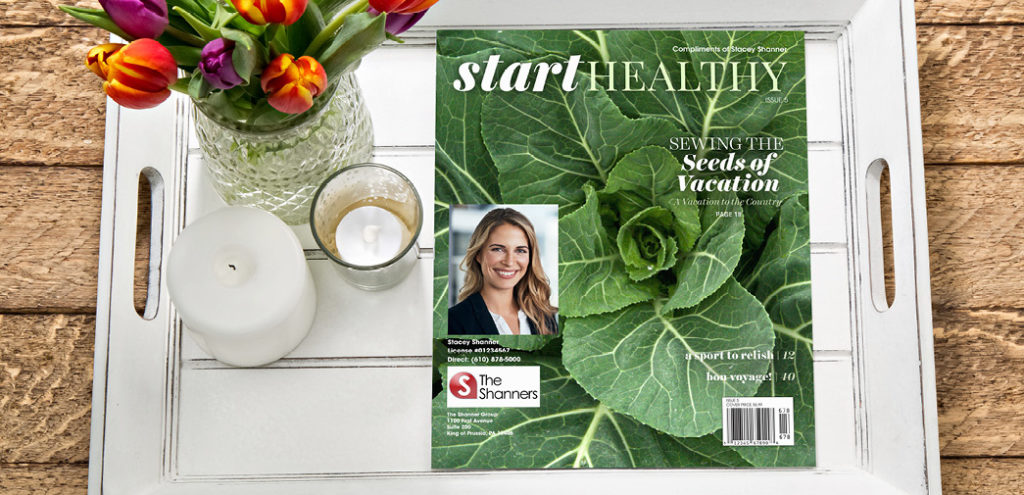 A copy of Start Healthy magazine is placed on a table beside a vase and a candle
