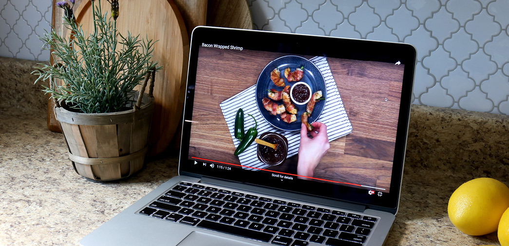 A laptop, tuned to a recipe video from American Lifestyle magazine