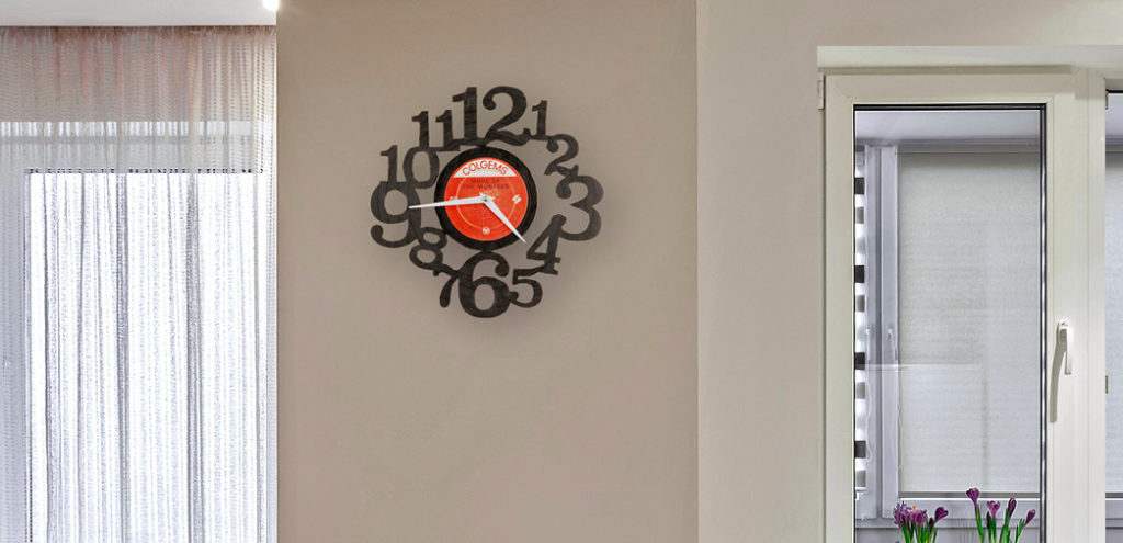 A unique clock comprised of cut-out numbers and a repurposed vinyl record