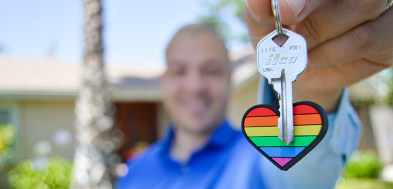 An agent hands over the keys to a new home