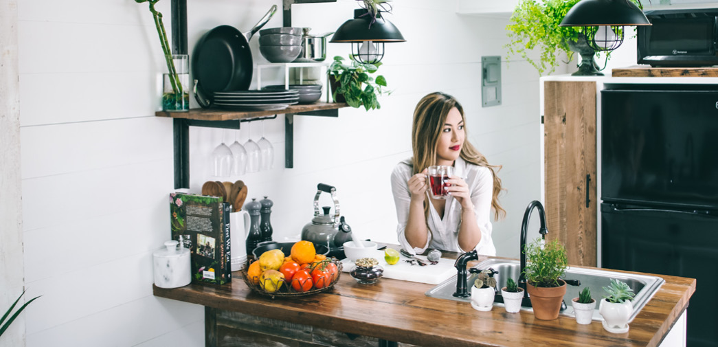 A home buyer stands in a kitchen