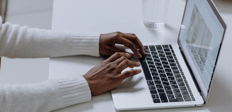 woman typing on computer