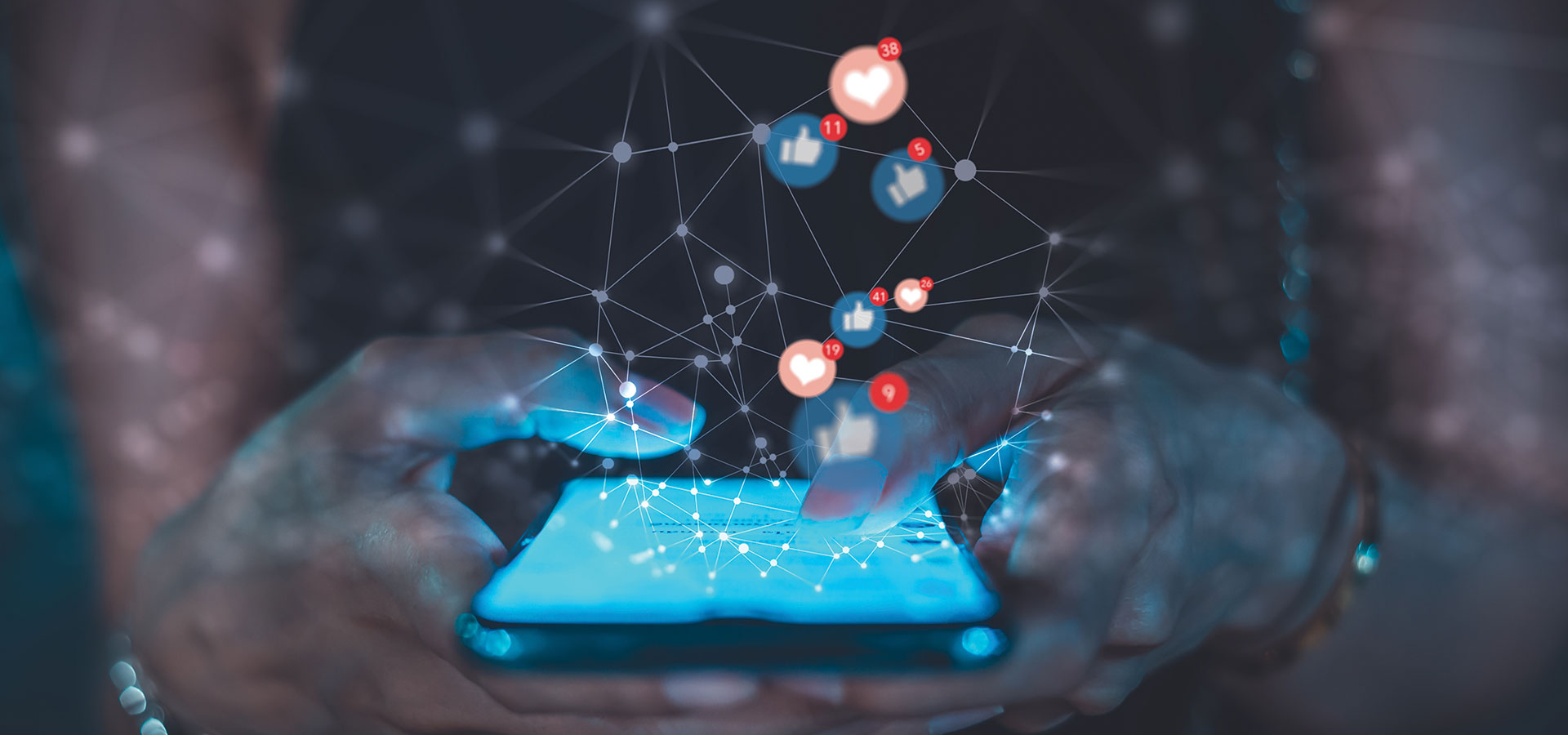 Social media graphics above person using phone